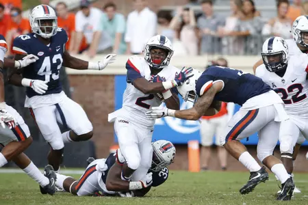 Sep 16, 2017; Charlottesville, VA, USA; Connecticut Huskies wide receiver Tyraiq Beals (2) carries the ball as Virginia Cavaliers defensive back Joey Blount (29) and Cavaliers safety Quin Blanding (3) defend during the second half at Scott Stadium. The Cavaliers won 38-18. Mandatory Credit: Amber Searls-USA TODAY Sport