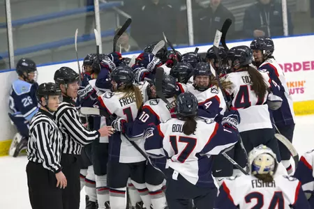 Huskies celebrate OT game-winner. (PC: Steve Slade)