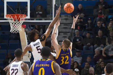 Huskies improve to 6-8 in American Athletic Conference play.
