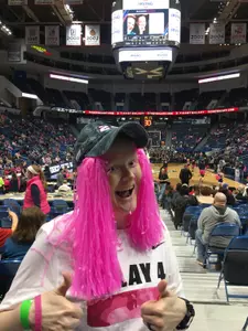 Jamie Cowie attending a women's basketball game at the XL Center.