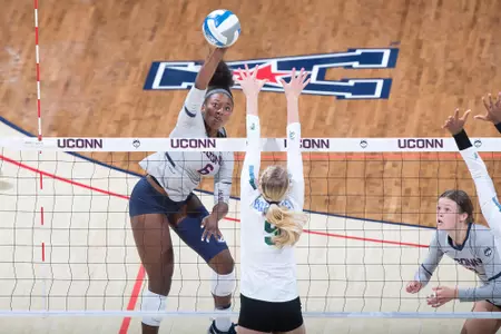 Kennadie Jake-Turner spikes the ball in a match vs. Tulane