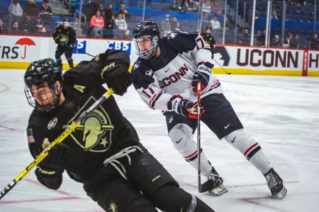 Marc Gatcomb looks for the puck in a game against Army