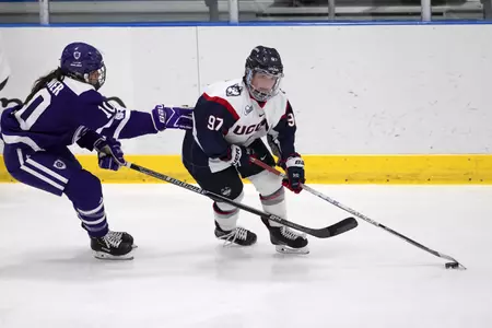 Catherine Crawley controls the puck against Holy Cross