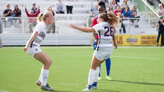Cara Jordan and Pato Jerzak celebrate a goal