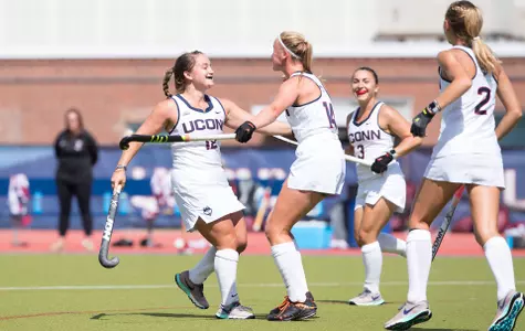 Kourtney Kennedy and Sophie Hamilton celebrate after a goa.