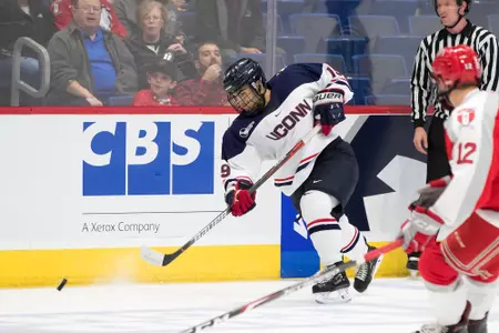 Brian Rigali shoots the puck in a game against RPI