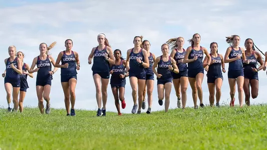 The Women's cross country team running