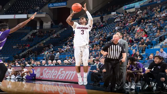 Alterique Gilbert shoots a three against St. Mchael's