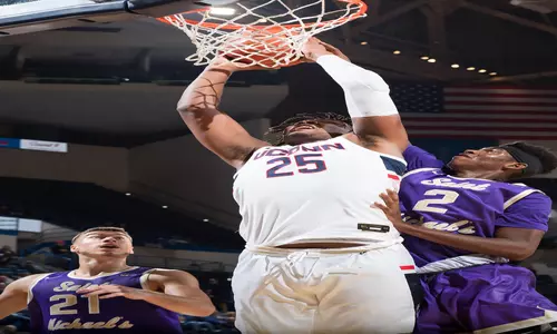 Josh Carlton goes for a dunk against St. Michael's