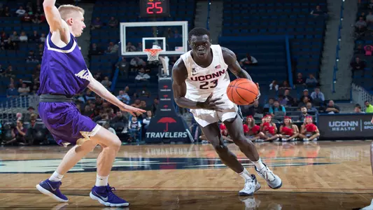 Akok Akok drives to the hoop against St. Michael's