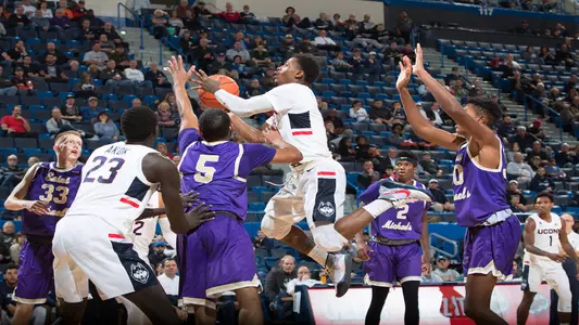 Alterique Gilbert goes up for a contested layup against St. Michael's