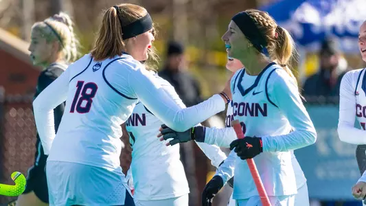 Jess and Claire celebrate a UConn goal
