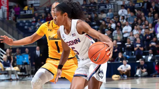 Crystal Dangerfield runs up the court.