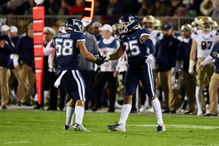 Dillon Harris and Tyler Coyle celebrate after a defensive stop.