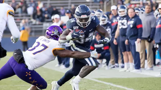 Kevin Mensah fights for an extra yard against ECU
