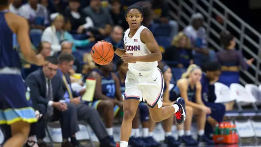 Crystal Dangerfield runs up the court.