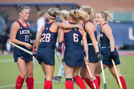 The Huskies celebrate after a goal.