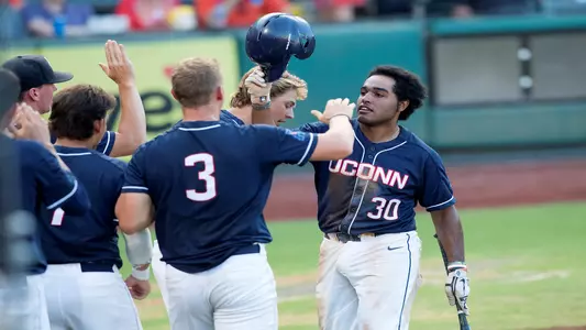 Thad Phillips and Kyler Fedko celebrate a run in a game against OSU