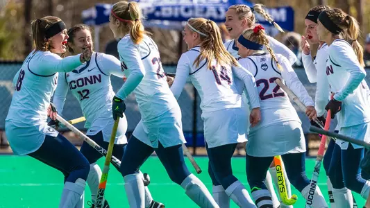 The Huskies celebrate after a goal.