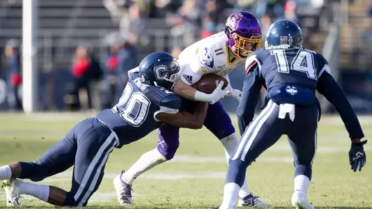 Rob King makes a tackle against ECU.