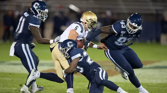 Rob King takes down a Navy ball carrier on November 1.