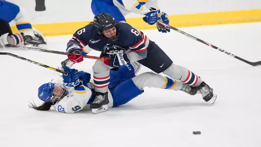 Jessie Aney fights for a puck against Ryerson
