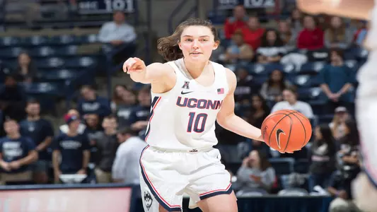 Molly Bent drives up the court against Tulsa