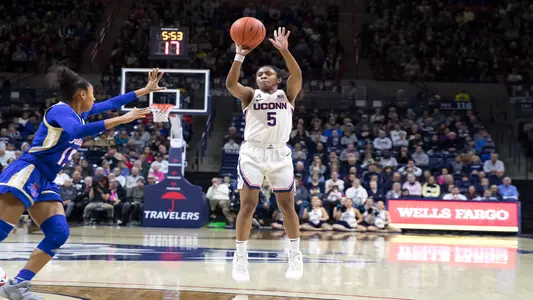 Crystal Dangerfield shoots a three in a game against Tulsa