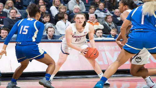 Molly Bent looks around the court versus Tulsa