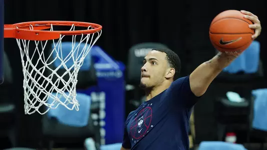 Tyrese Martin goes up for a dunk during warmups prior to his UConn debut.