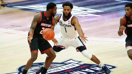 RJ Cole defends a Hawk during UConn's game against Hartford on November 27.