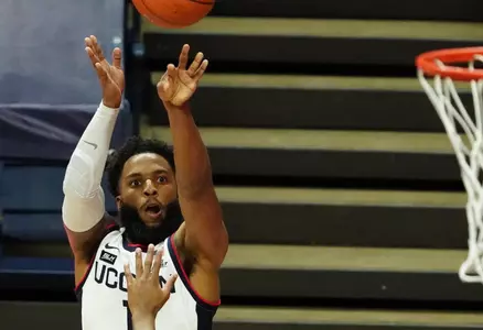 RJ Cole takes a three-pointer vs. Hartford on November 27.