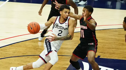 James Bouknight drives to the hoop against Hartford on November 27.