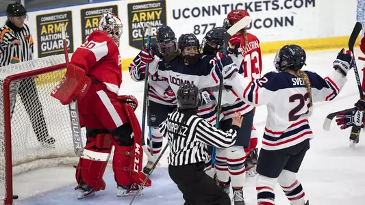 Kate Klassen celebrates with teammates after scoring a goal against BU on December 11, 2020.