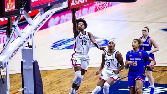 Christyn Williams takes it to the hoop against UML on December 12, 2020.