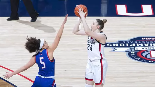 Anna Makurat takes a three-pointer against UMass-Lowell on December 12, 2020.