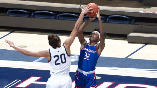 Olivia Nelson-Ododa blocks a shot against UMass-Lowell on December 12, 2020.
