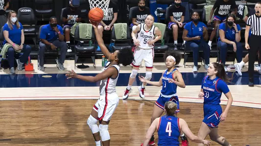 Christyn Williams drives to the hoop against UMass-Lowell on December 12, 2020.