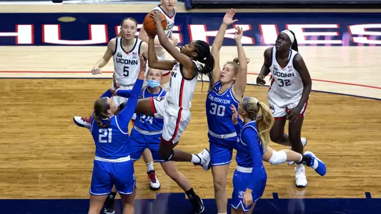 Mir McLean takes a shot in traffic against Creighton on December 17, 2020.