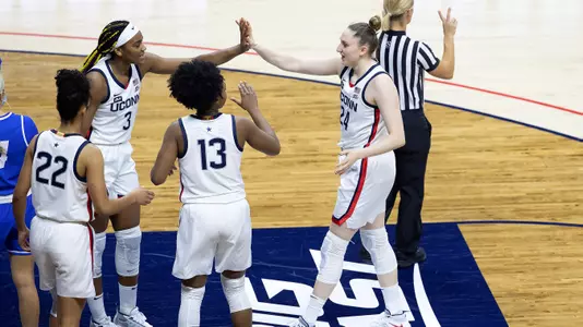 Anna Makurat is congratulated by her teammates against Creighton on December 17, 2020.