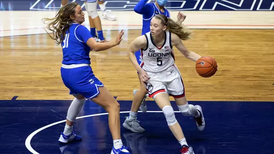 Paige Bueckers dribbles through the paint against Creighton on December 17, 2020.