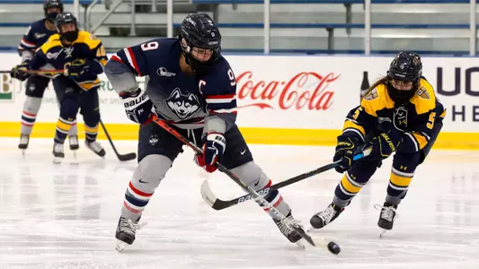 Natalie Snodgrass controls the puck against Merrimack on December 18, 2020.