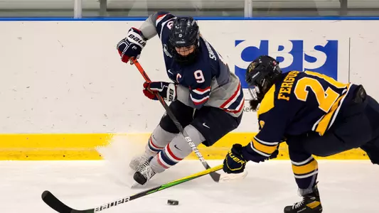 Natalie Snodgrass controls the puck against Merrimack on December 18, 2020.