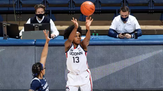 Christyn Williams shoots a three-pointer against Xavier on December 19, 2020.