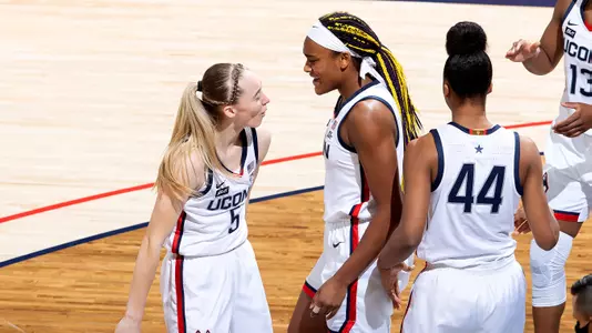 Aaliyah Edwards celebrates with her teammates against Xavier on December 19, 2020.