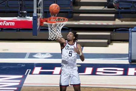 Isaiah Whaley rises above the rim for the tip in bucket in the game against Creighton on December 20th 2020