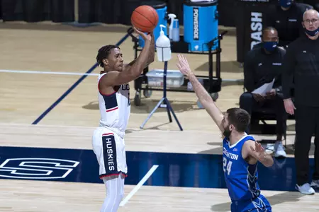 Brendan Adams takes the shot over the defender in the game against Creighton on December 20th 2020