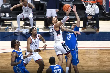 James Bouknight drives to the basket drawing the foul in the game against Creighton on December 20th 2020