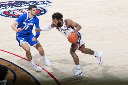 Rj Cole drives past the defender for game against Creighton on December 20th 2020