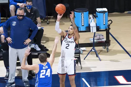 James Bouknight takes the shot over the defender in the game against Creighton on December 20th 2020